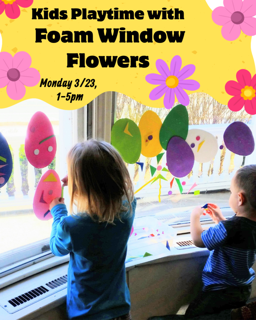 A photo showing children decorating a library window with brightly colored foam shapes.
