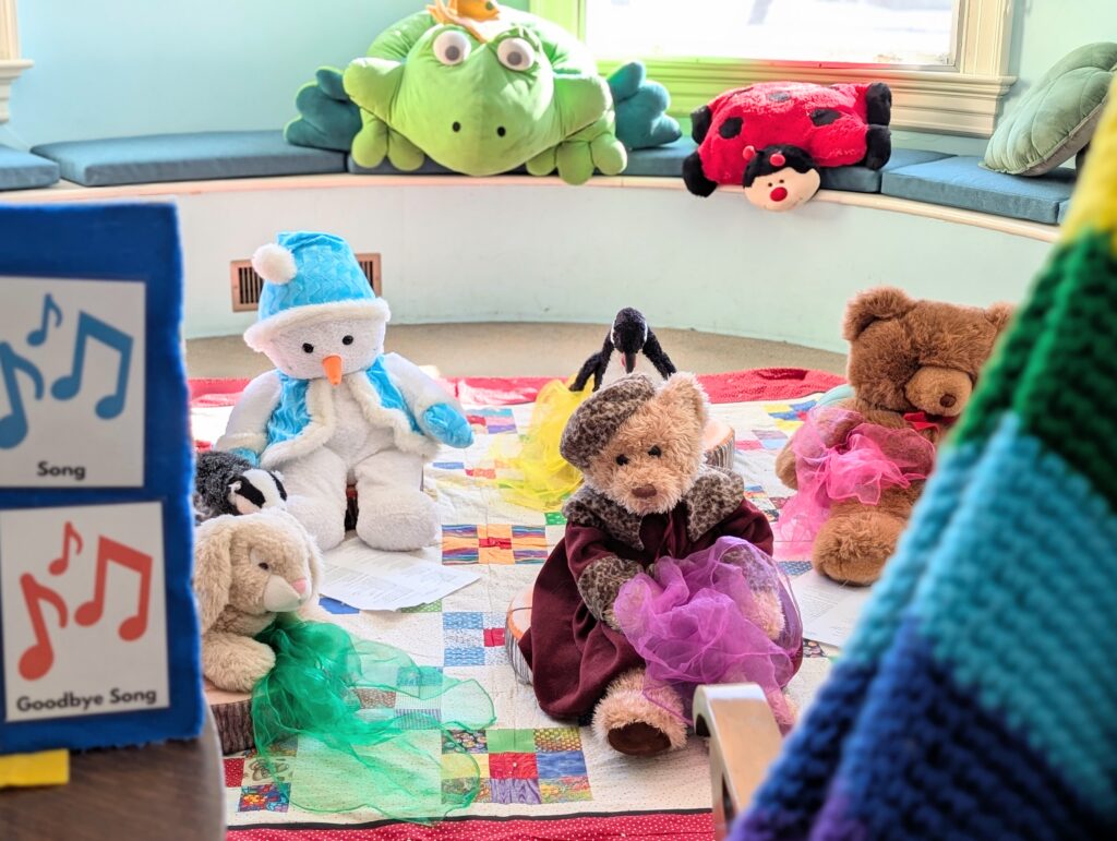 Photo shows plushie stuffed animals enjoying a children's storytime at the Richards Free Library.